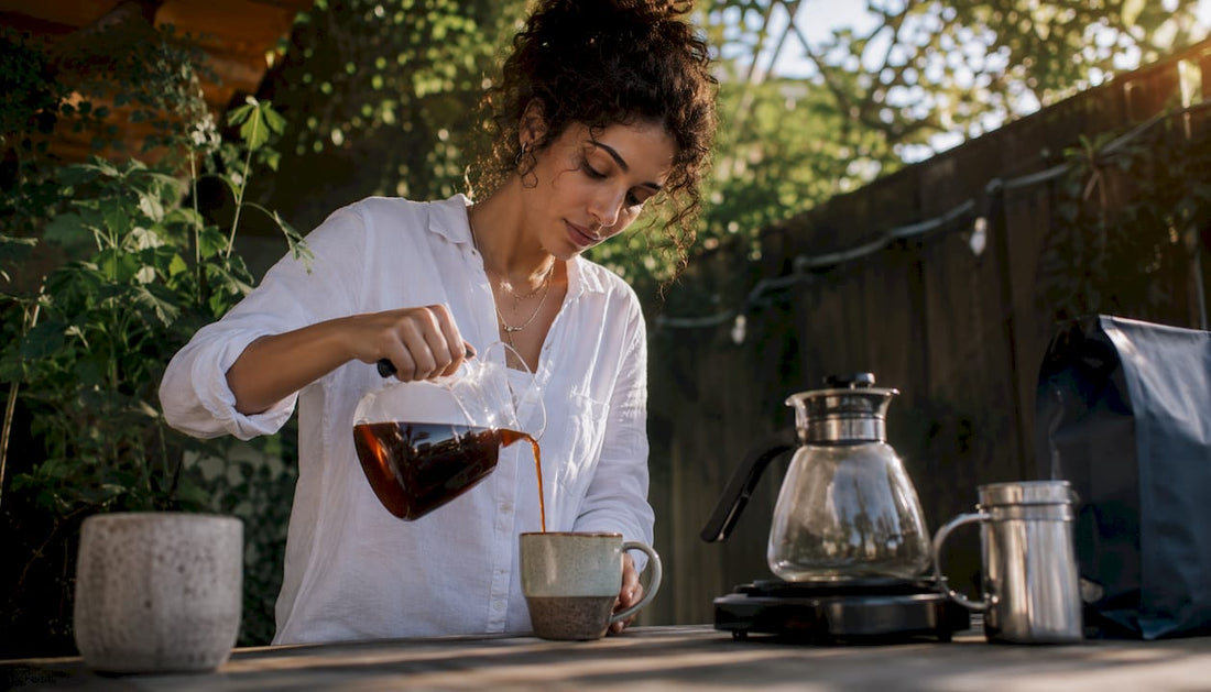 Woman pouring coffee using Cafe Brew accessories