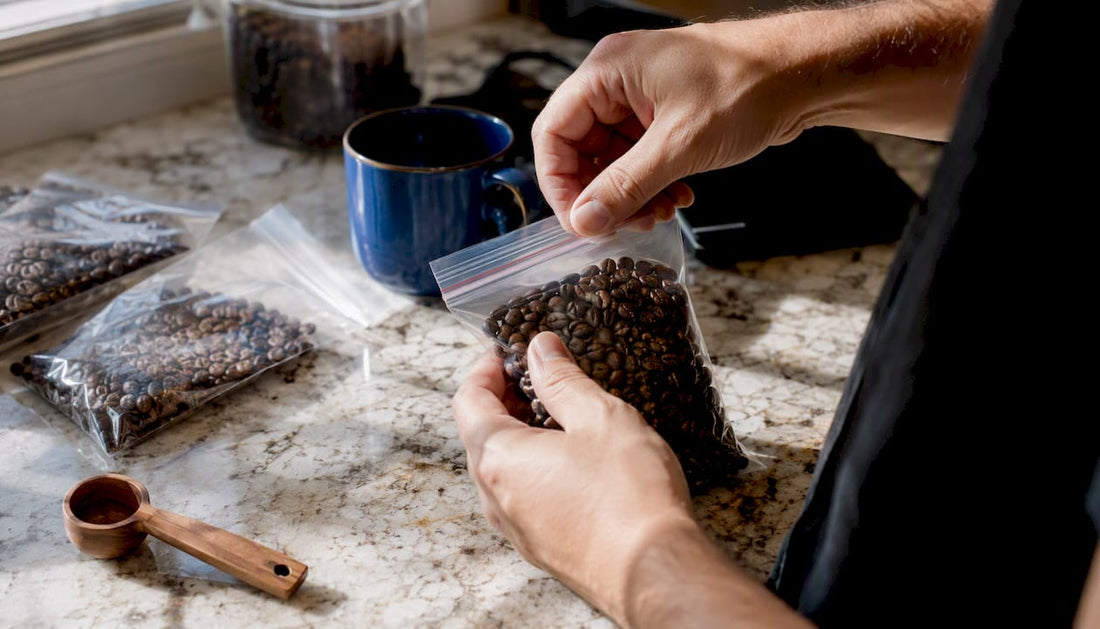 Hands portioning coffee beans into freezer bags