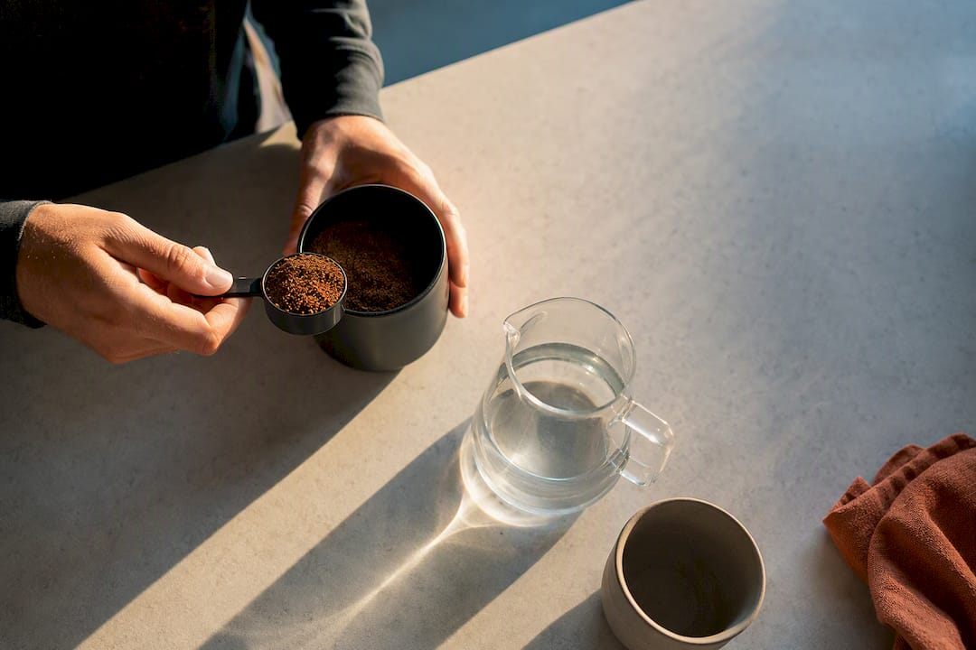 Coffee grounds and water prepared for brewing